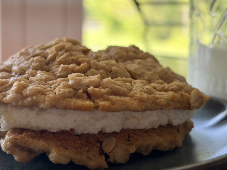 freshly milled oatmeal cream pies with a glass of milk